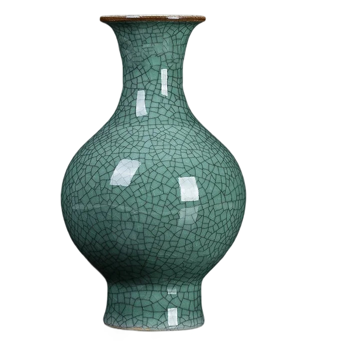 a green vase with a cracky design on it