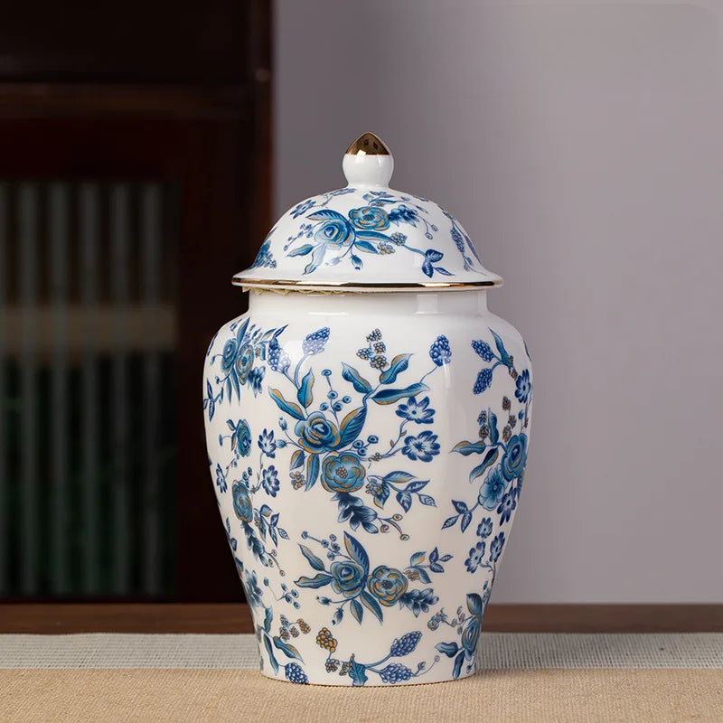 a blue and white vase sitting on top of a table