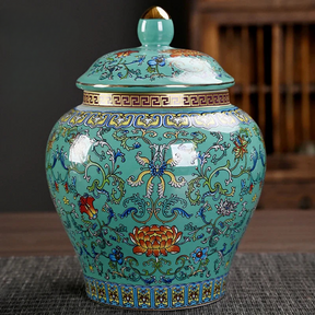 a blue vase with a lid sitting on a table