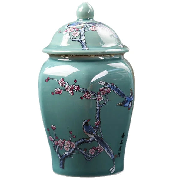 a blue vase with a bird painted on it