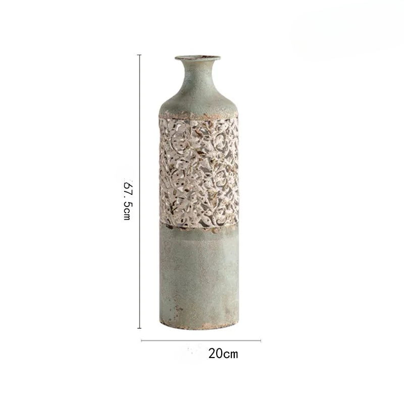 a tall vase with a flower pattern on it