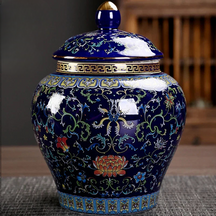 a blue vase with a lid on a table