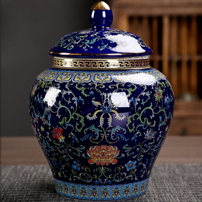 a blue vase with a lid on a table