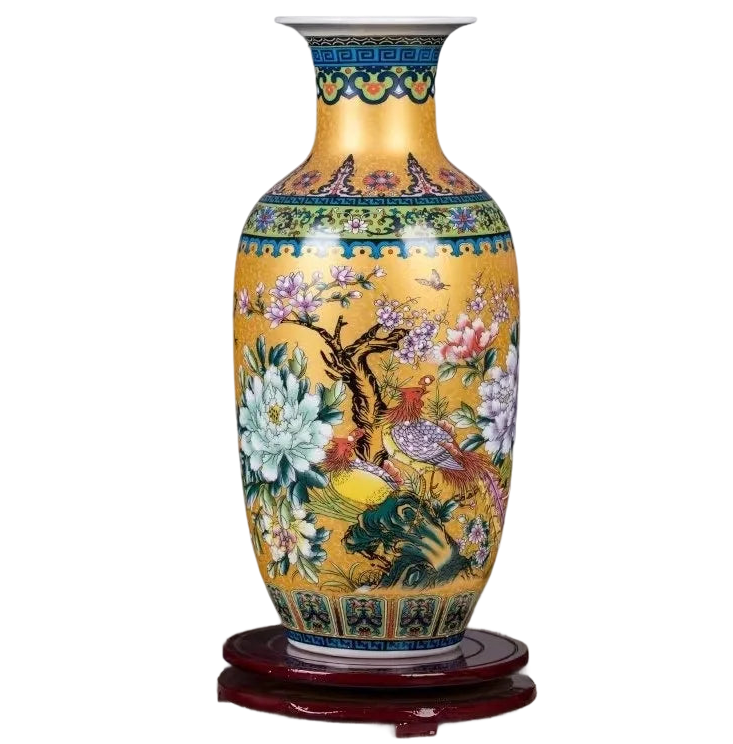 a yellow vase with flowers and birds painted on it