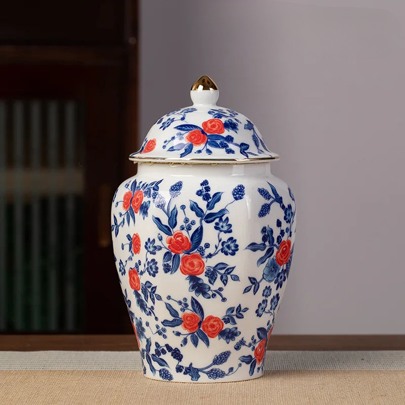 a blue and white vase sitting on top of a table