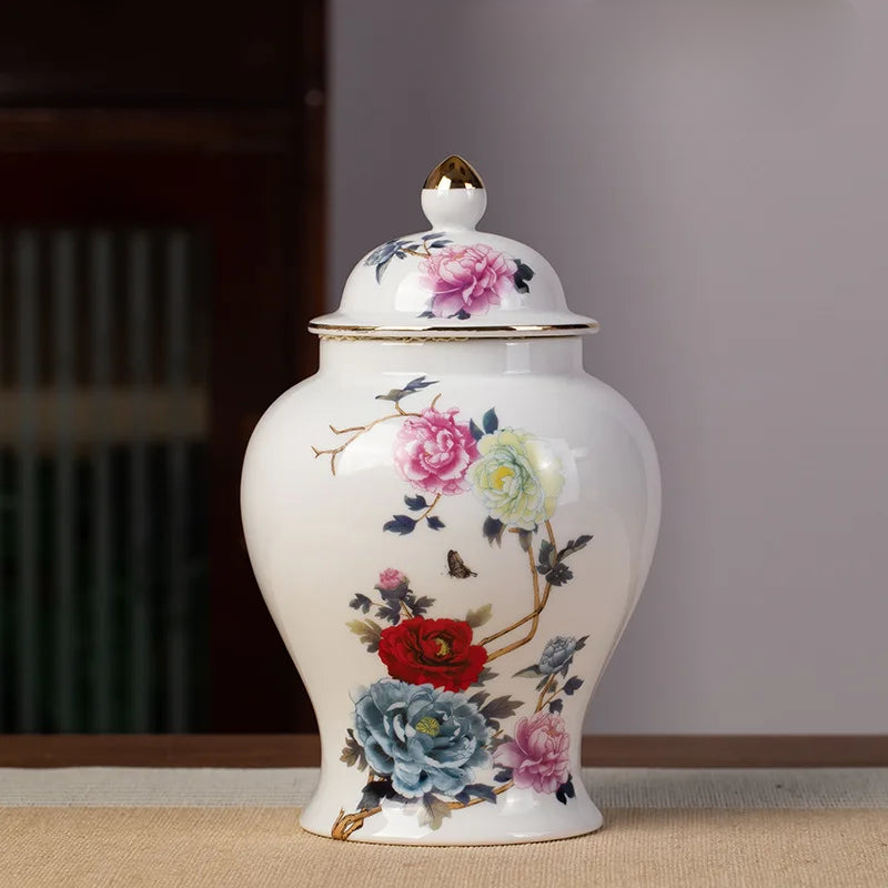 a white vase with flowers painted on it