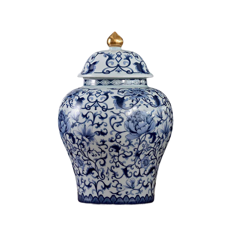 a blue and white vase sitting on top of a wooden table