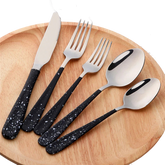 a set of five black and white utensils