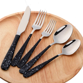 a set of five black and white utensils