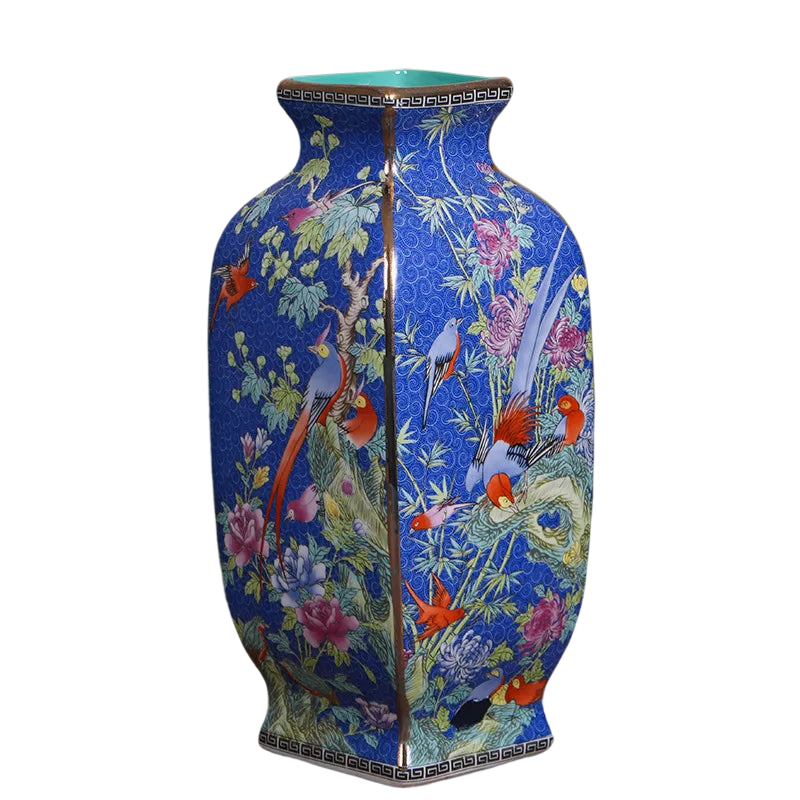 a blue vase with birds and flowers painted on it