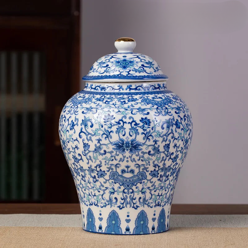 a blue and white vase sitting on top of a table