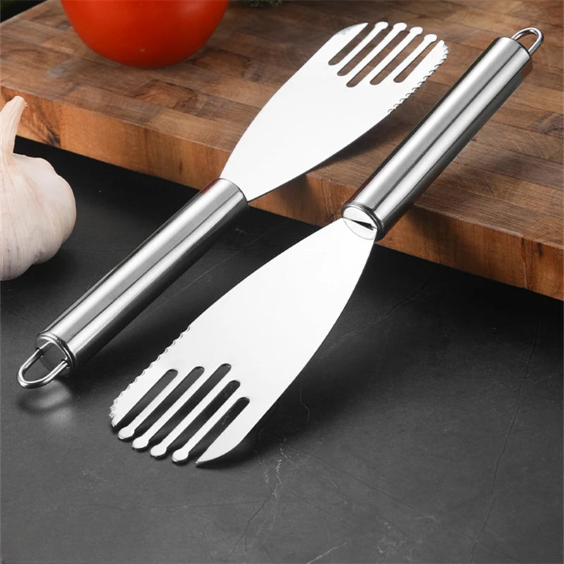 a pair of spatulas sitting on top of a cutting board