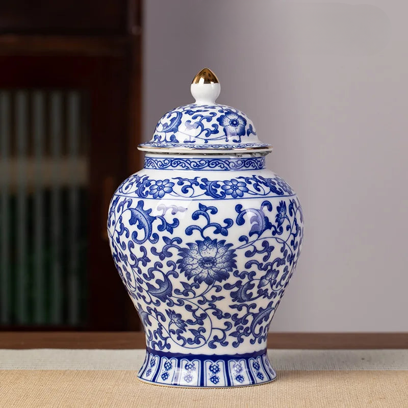 a blue and white vase sitting on top of a table