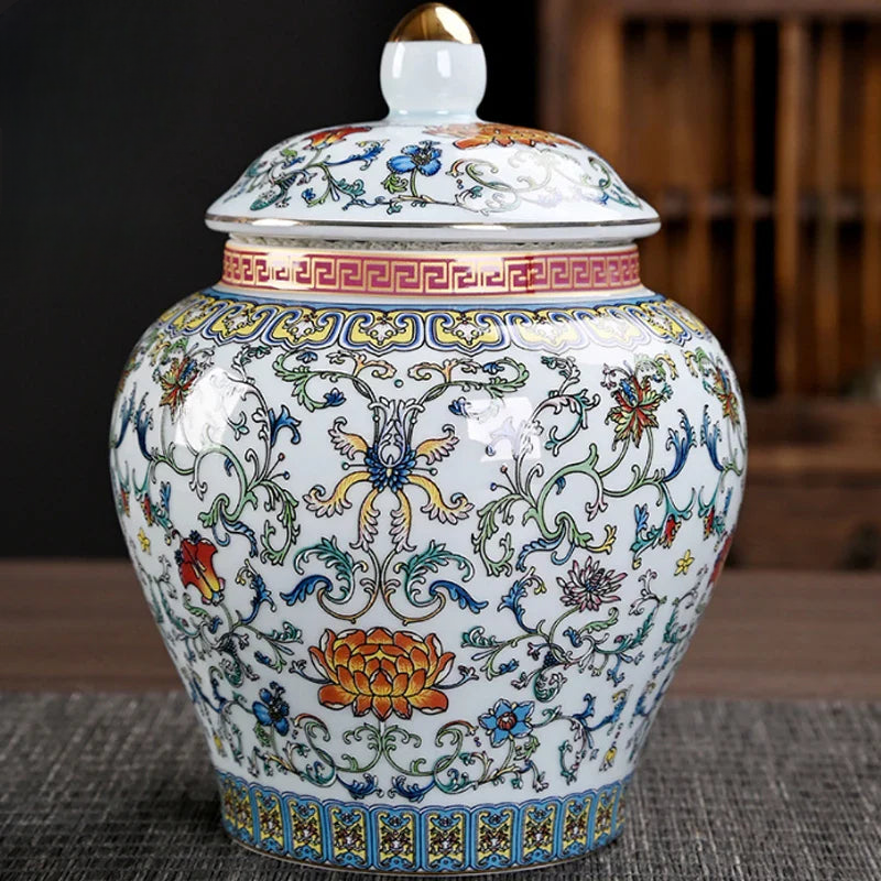 a white and blue vase with a lid on a table