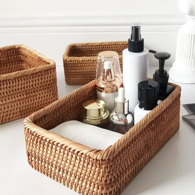 a set of three wicker baskets sitting on top of a table