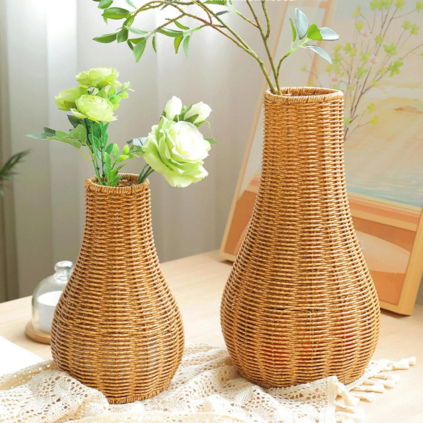 a couple of vases sitting on top of a table