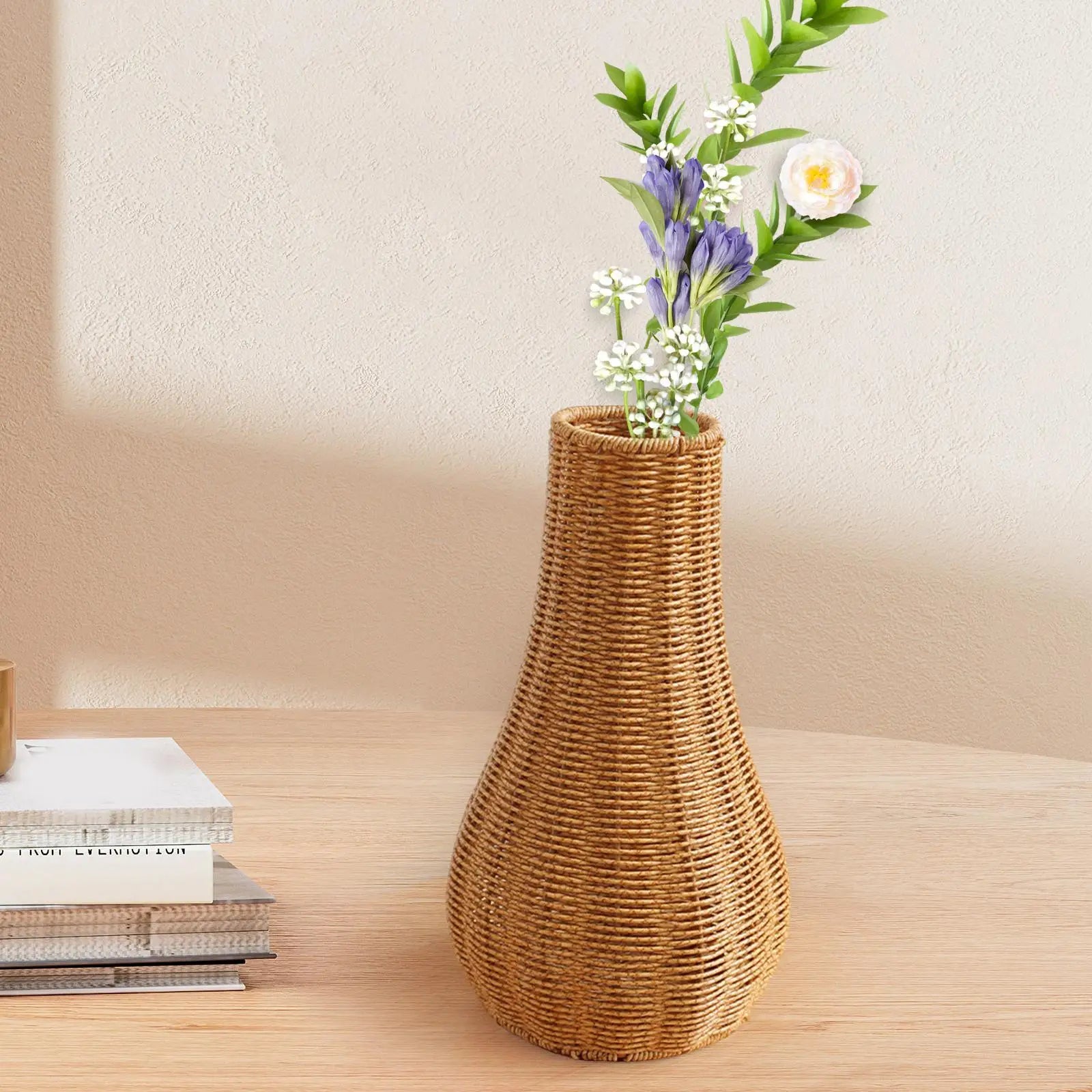 a vase with flowers in it sitting on a table