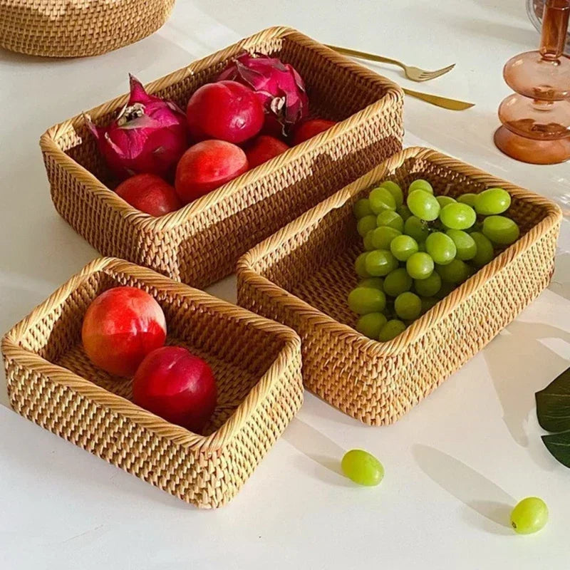 a couple of baskets filled with fruit on top of a table