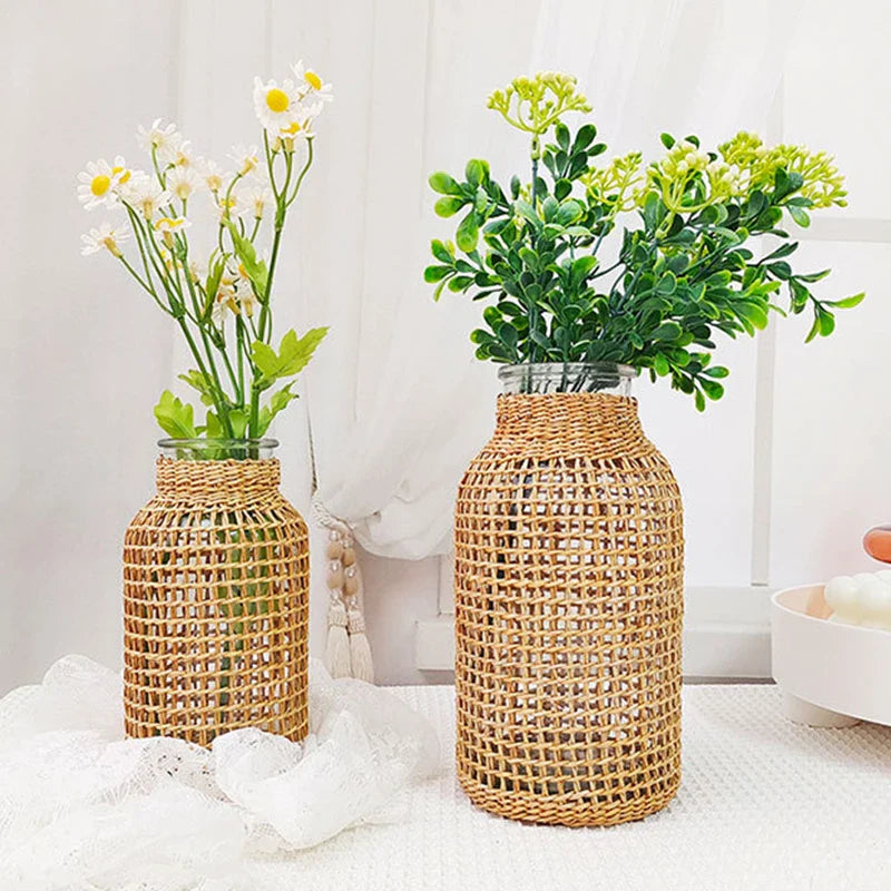 a couple of vases sitting on top of a table