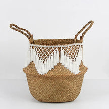 a woven basket with tassels on it