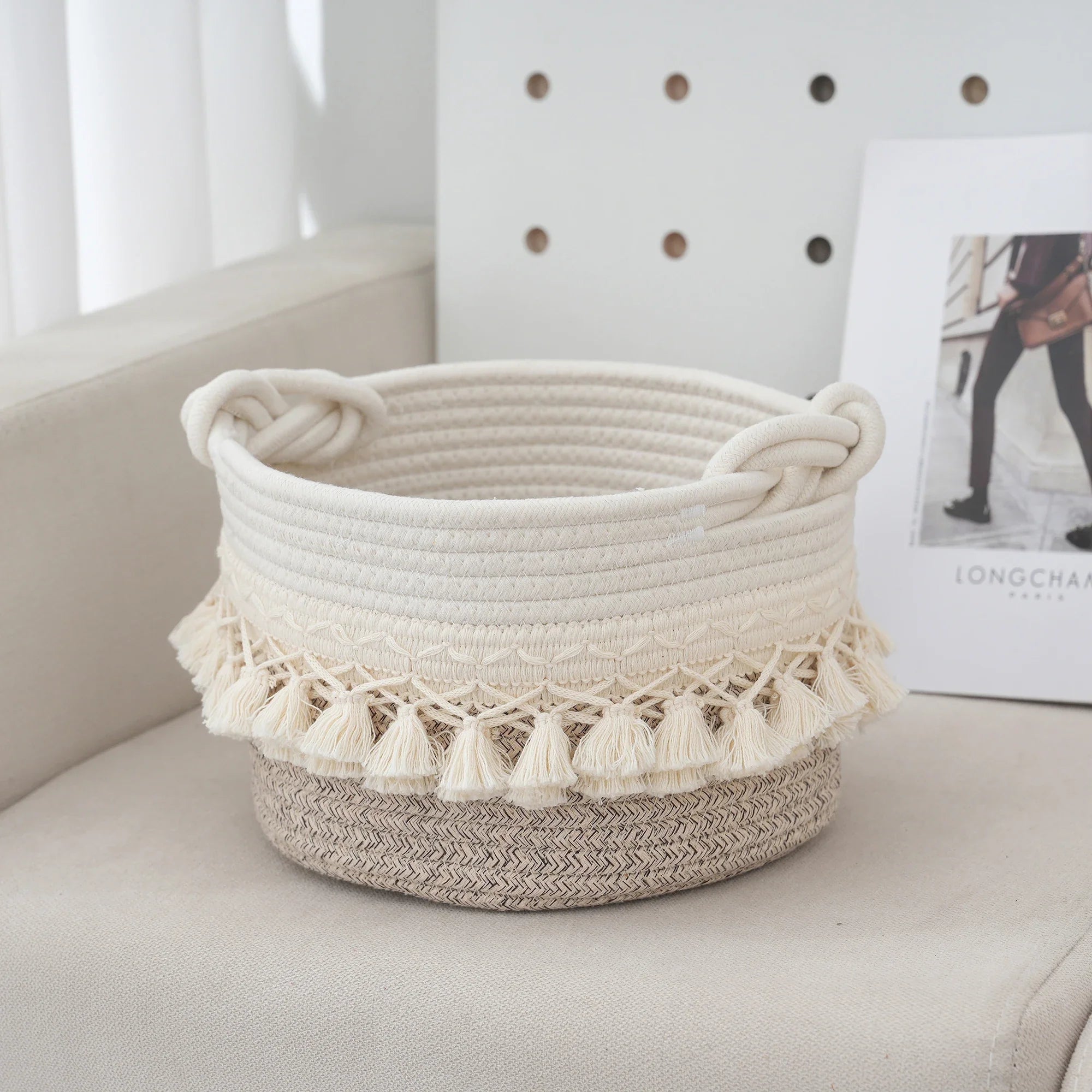 a white basket sitting on top of a chair