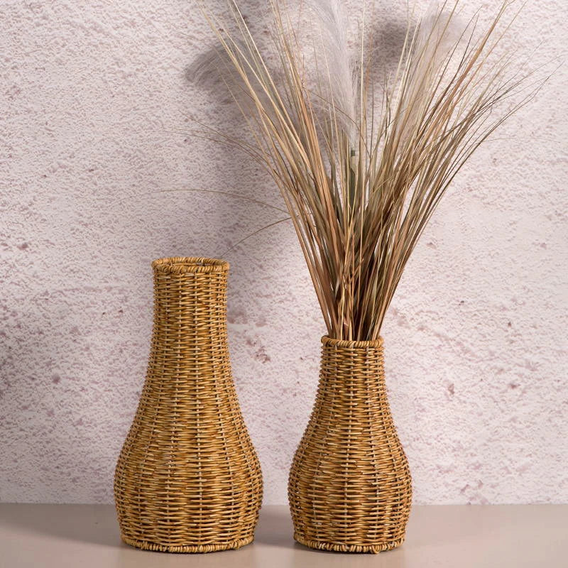 a couple of vases sitting on top of a table