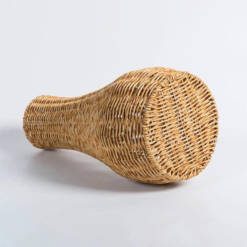 a wicker basket sitting on top of a white table