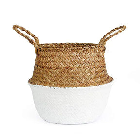 a white and brown basket sitting on top of a table