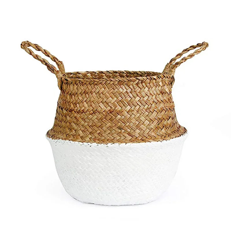 a white and brown basket sitting on top of a table