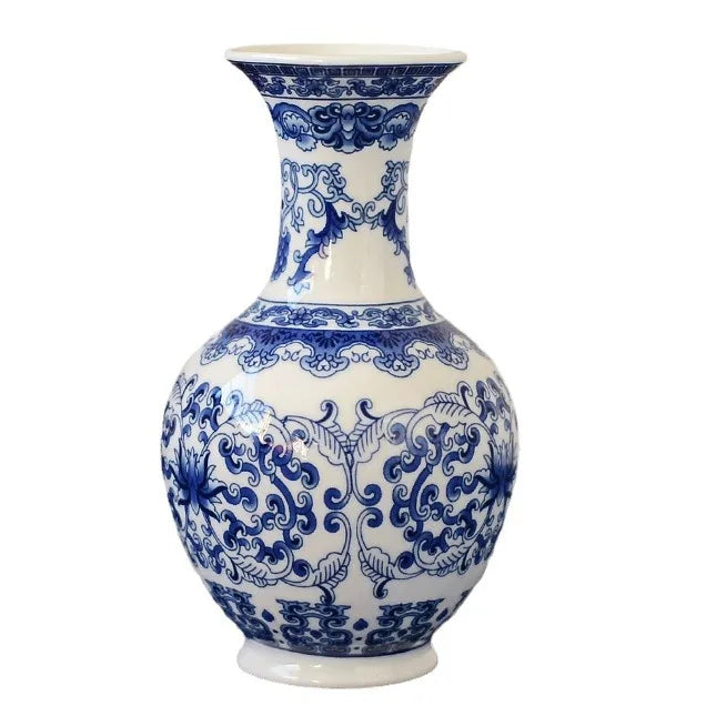 a blue and white vase sitting on top of a table