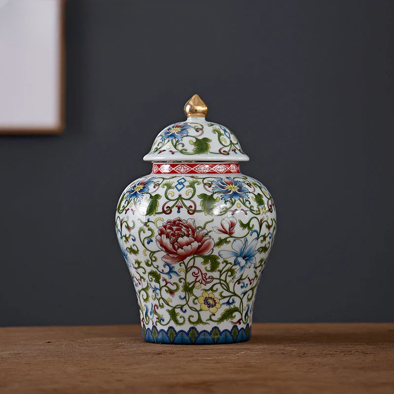 a white and red vase sitting on top of a wooden table