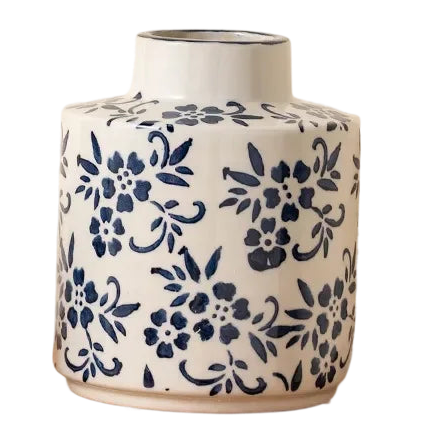 a blue and white vase with flowers on it