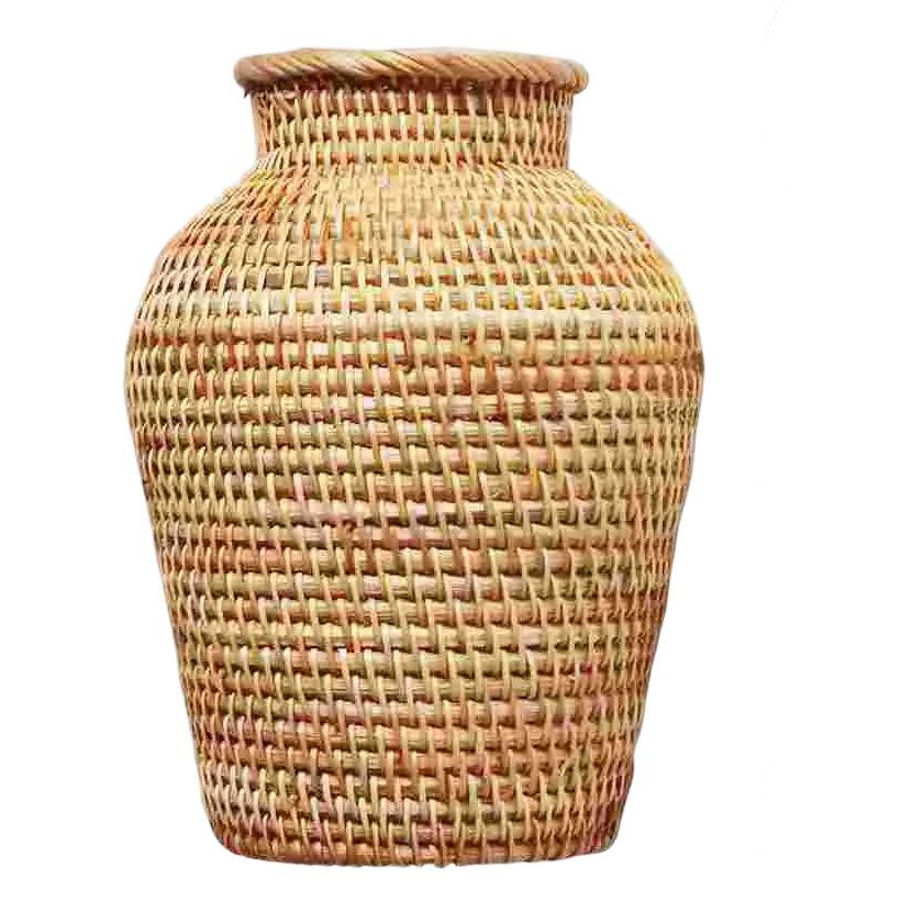 a wicker vase is shown against a black background