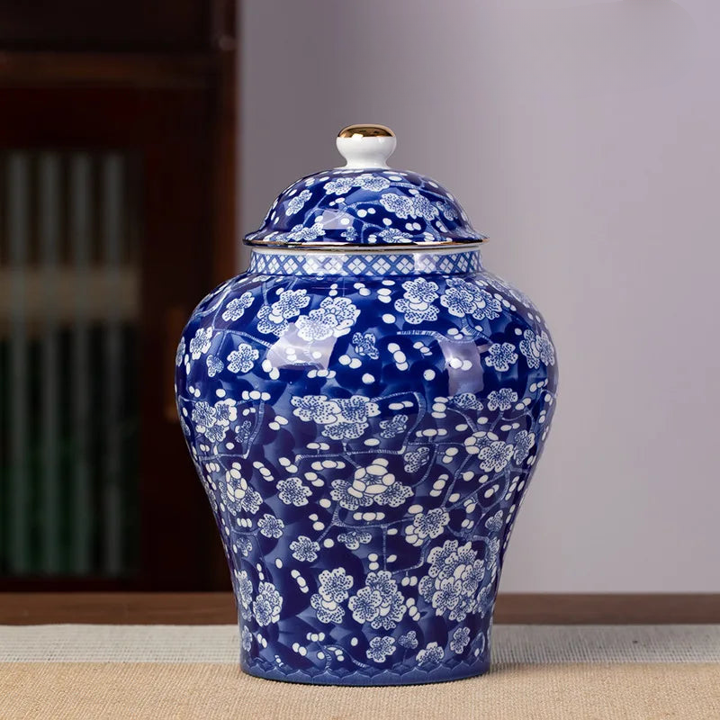 a blue and white vase sitting on top of a table